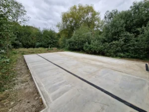 Finished concrete pad with integrated drainage channels installed in Stowmarket.